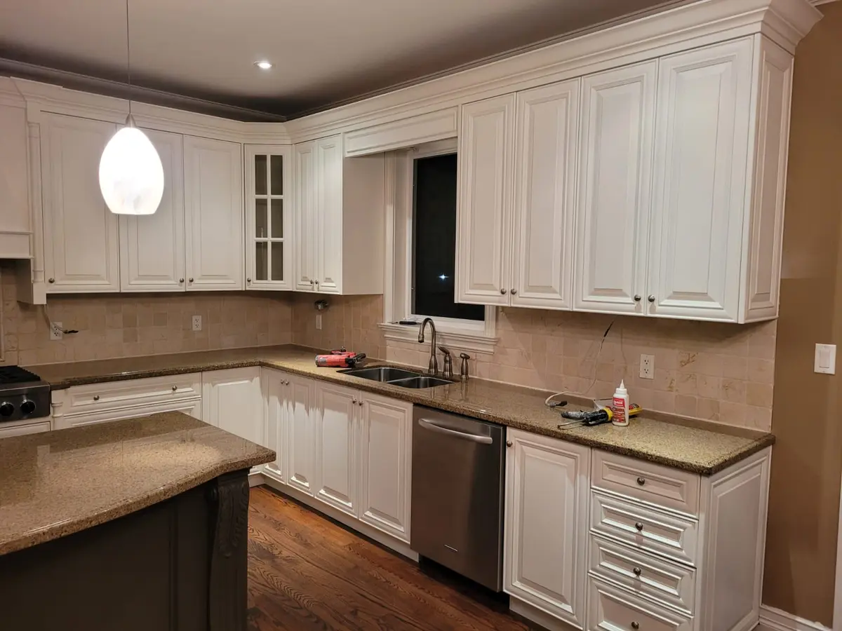 Professional kitchen cabinet painting in Toronto - factory-smooth spray finish by Home Painters Pro Kitchen Cabinet Painting Toronto