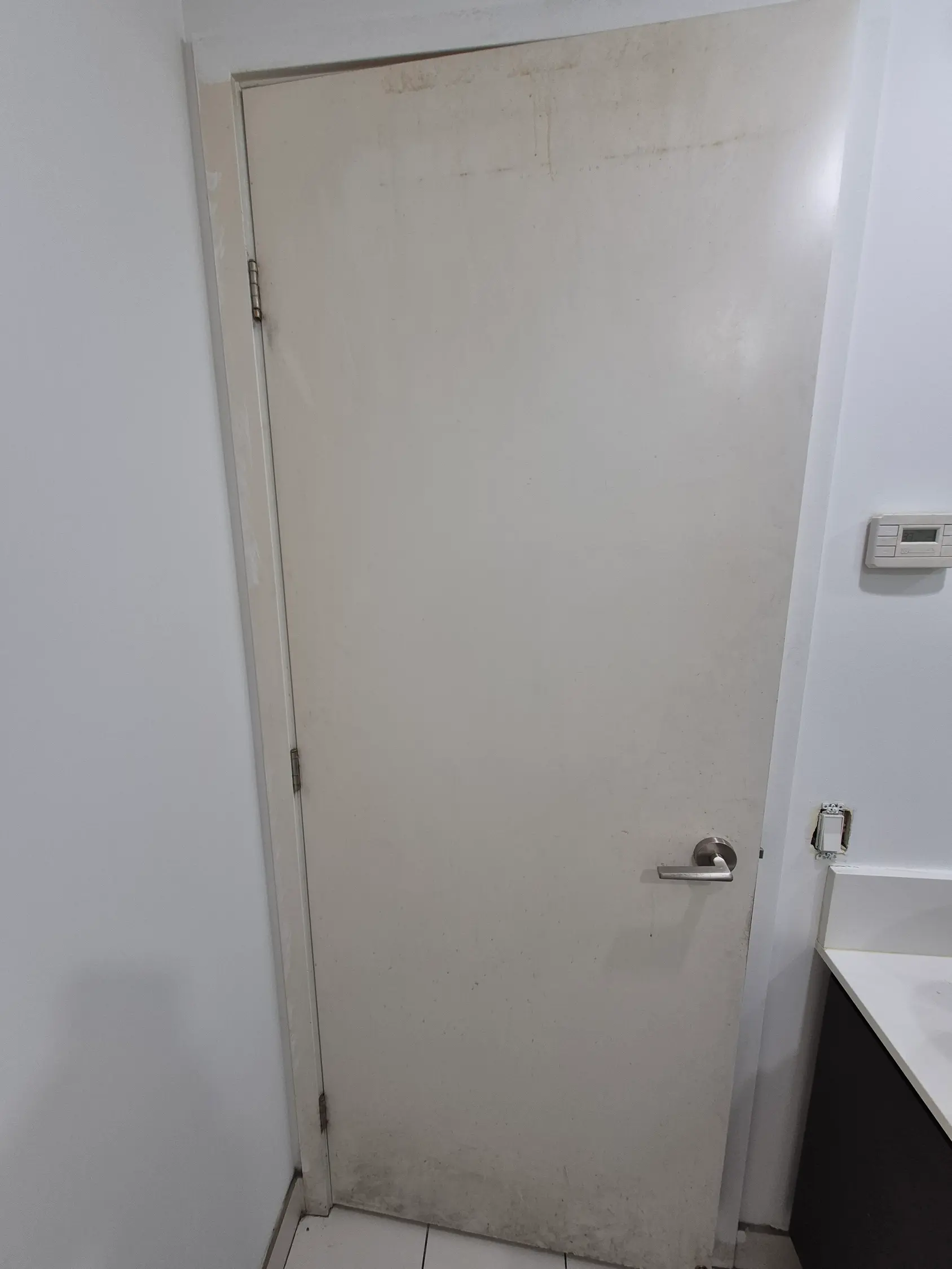 dirty condo bathroom door