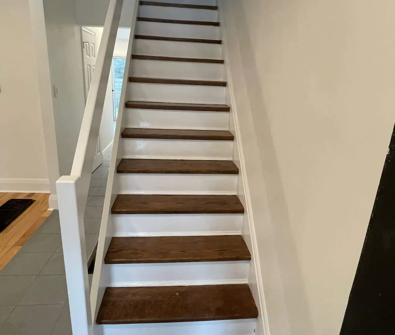 Toronto painter inspecting a wall to diagnose a paint defect before repair