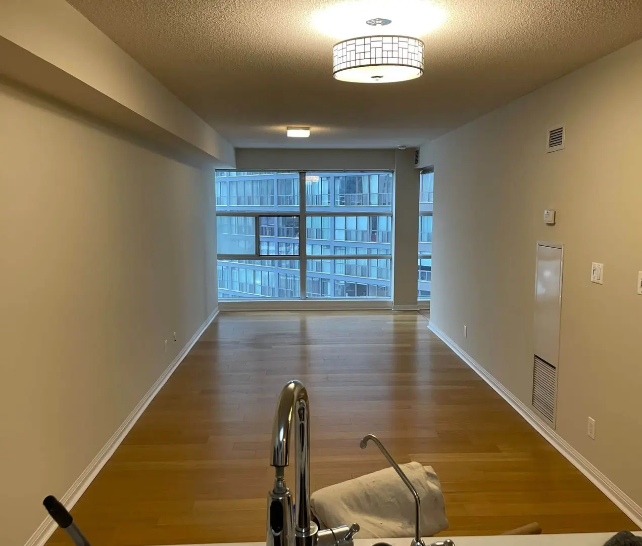A stipple ceiling in a Toronto condo: whether it can be scraped, covered, or left alone depends on a lab result, not on its appearance Textured stipple ceiling in a Toronto condo, lit from a flush ceiling fixture