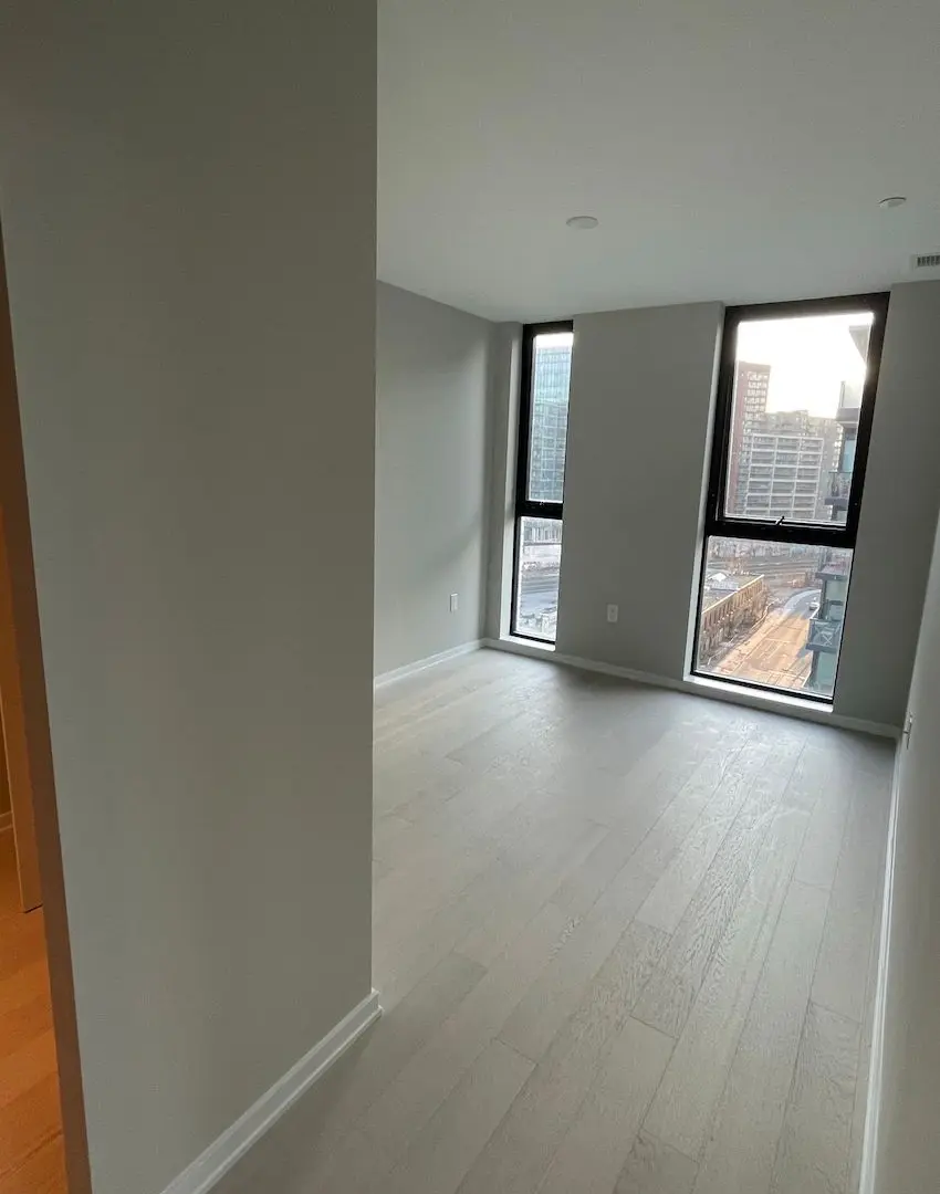 A grey, weathered, and splintery wood deck in need of refinishing.